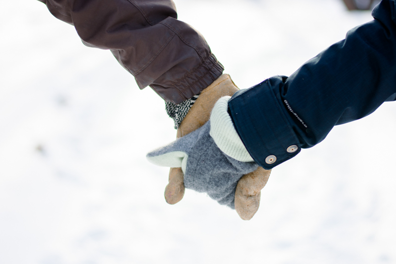 Couple Holding Hands with Mittens